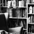 black and white styled image of a library with armchair