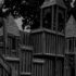 A stylized black and white image of a dark playground