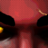 A stylized extreme close-up of yellow demonic eyes.